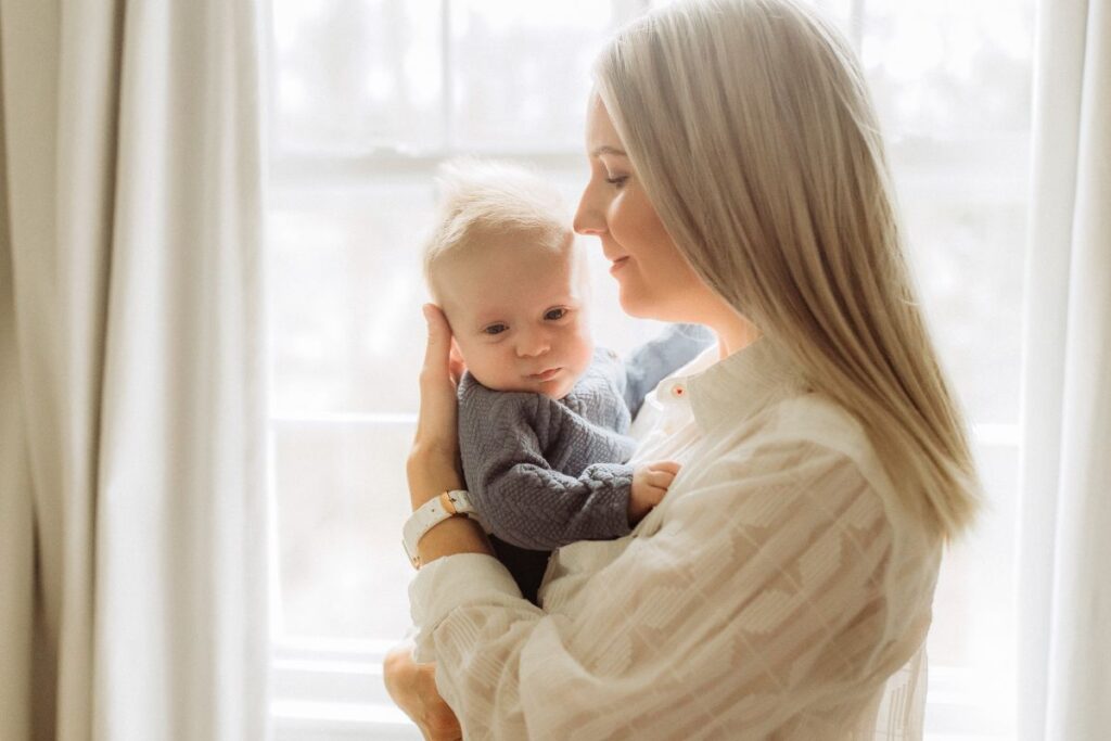 mother holding a baby